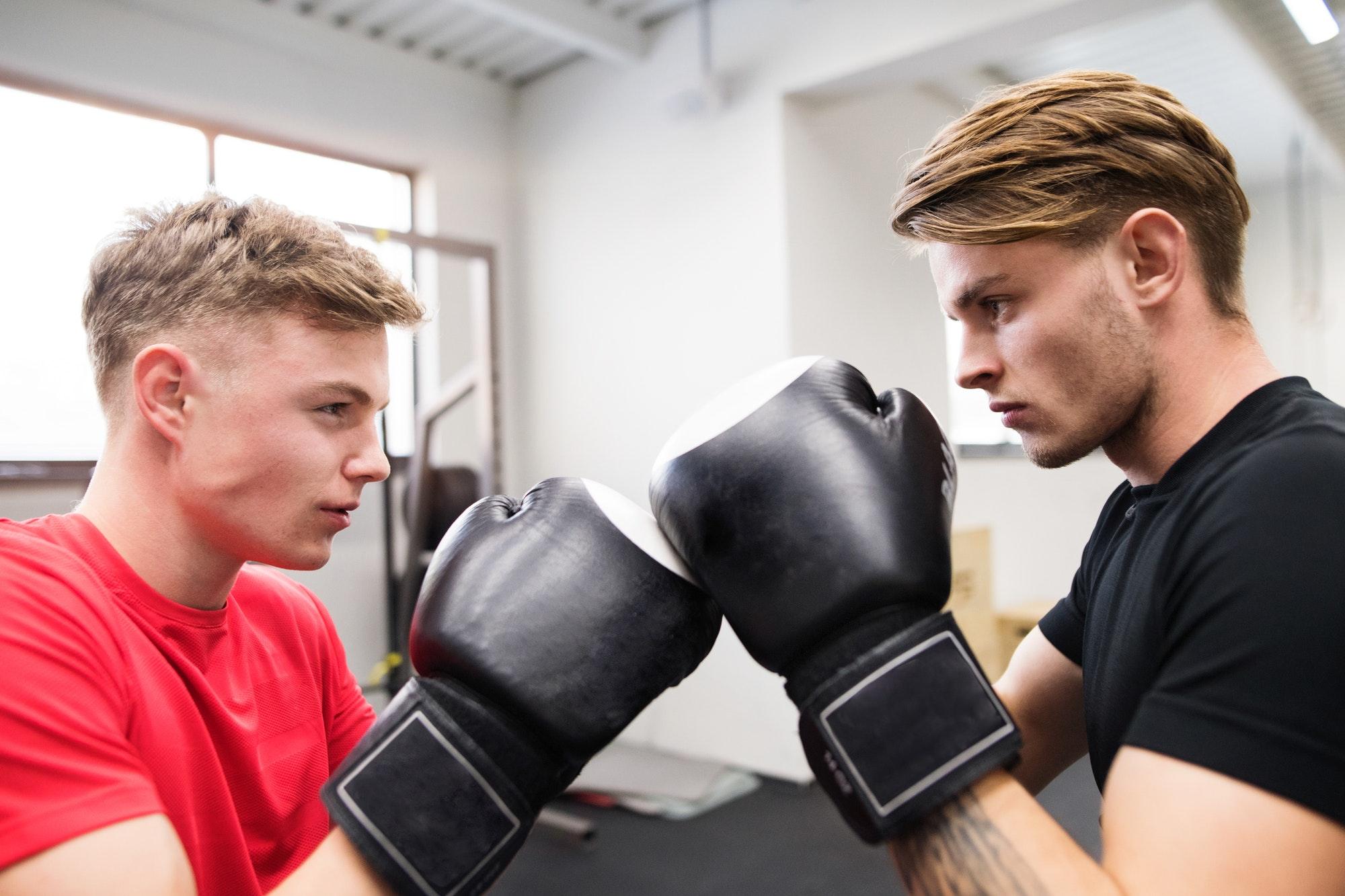 two-fit-handsome-men-in-gym-boxing-.jpg two-fit-handsome-men-in-gym-boxing-.jpg